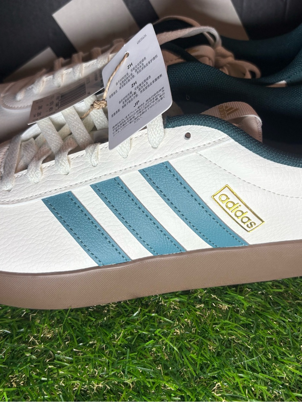 adidas Men’s White Sneakers with Teal Stripes and Tan Sole